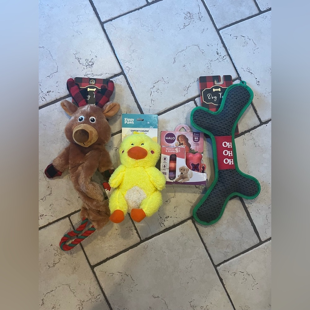 Lot of three NWT dog toys and dog poop bag holder with three rolls
